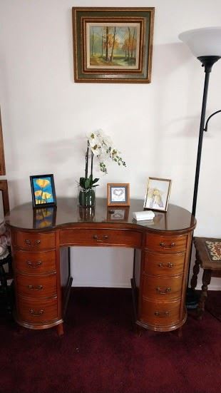 Lounge Area Left:  Beautiful Vintage Curved Desk w/Glass Top, Vase, Pictures 