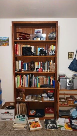 Back Bedroom Center:  6 Shelf Book Case, German Biplane Model, Books, Albums, Sheet Music