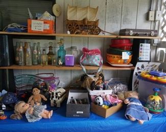 dolls, wagon lamp, cow decor, pop bottles