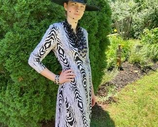 Diane von Furstenberg, black and white printed silk jersey classic wrap dress. Hat: Frank Olive, black straw hat with net veil.