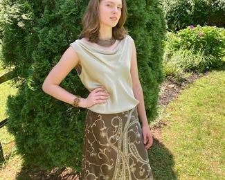 Top: Regina Porter pale green charmeuse top
Bottom: printed skirt