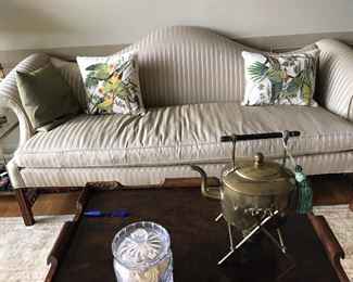 Beautiful Camel Back Sofa and with fret work legs. Rolled arms