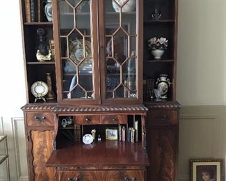 This is an Amazing Chippendale Bookcase, curio cabinet/desk. When you fold up desk, it blends in beautuifully.