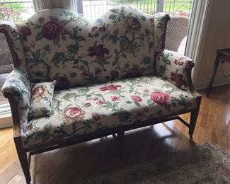 Love this double camel wingback love seat with rolled arms.