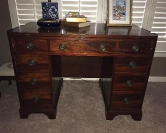 This little desk is a charmer and so versatile. The top flips to the front for more space and the back has a drop leaf that can be raised making this little desk into a nice table for dining or additional work space. More pictures to follow.