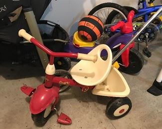 Childs little trike with pusher, toys and other little pedal toys