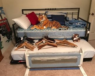 This trundle bed is amazing. The trundle pops up even with day bed. Love Tony the Tiger