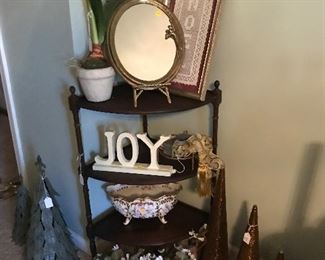 Love this corner shelf. This room is full of entertainment supplies, place settings, decor, wrapping paper, ribbon, Glasses, plates etc. Fun fun room