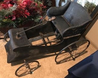 Antique peddle buggy w leather seat steering stick wire wheels and peddles. Great Condition.