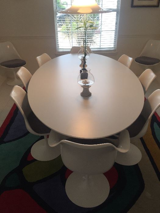Knoll Saarinen Dinning Table sold.

 The Knoll Saarinen Tulip Chairs are still available.  There are 8 armless and 2 with Arms.  They are all swivel. Purchased in 1970/1971