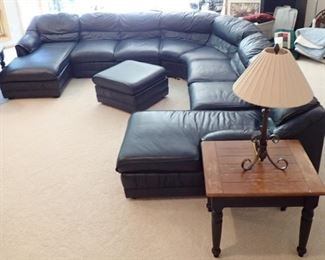 THIS IS ONE SPECTACULAR LEATHER SECTIONAL  103" TO MIDDLE OF CURVE 141" PLUS TO END -  THE CHASE'S ARE 63" FRONT TO BACK - OTTOMAN IS 26" SQUARE.  FROM DAYTONS  - GREAT CONDITION