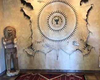 Massive 9x7 Buffalo hide with painted tribal images, $3,600, Germantown Revival wool rug with  geometric patterning $4,000.  Plus a six foot tall mahogany wood Cigar Store Indian, $2,000