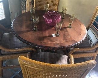 Fun pub table with leather and wicker chairs.