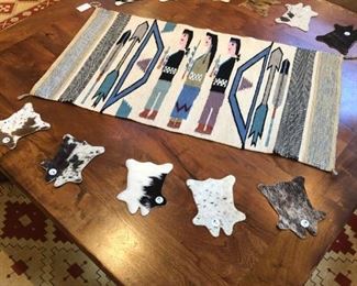 Yei rug, mesquite coffee table, and cowhide coasters.