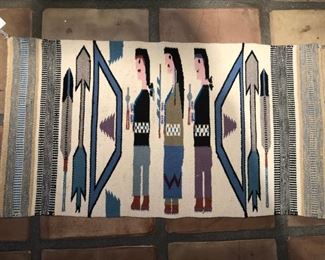 Unusual Yei rug with three figures in profile, bows, arrows, and feathers.