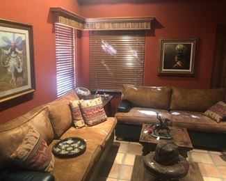 Handsome and comfortable micro-suede and green leather sofas, pastel "Power Steering, Power Breaks" by Pat Skiva, portait of a Native American woman with pottery by Peter Van Dusen.