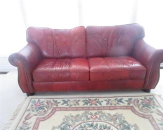 Leather sofa with nail head trim