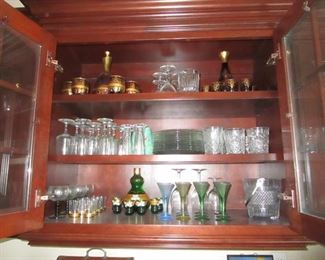 Decanters with matching cordials and assortment of wine goblets