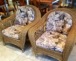 Two of a set of six large whicker style armchairs