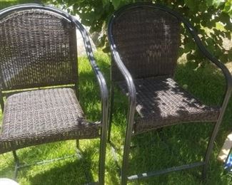 Two of four patio chairs