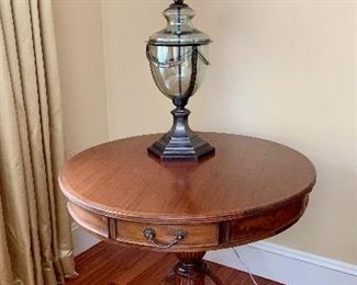 Item 64: 4-Drawer Drum Table with decorative brass toe caps - 36.5" x 31": $495