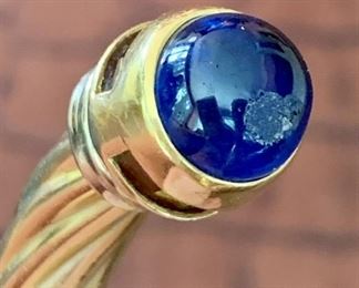 There is a bit of an issue with the sapphire cabochon - you can see that there is an abrasion to it - this can be polished out by a jeweler and does not detract from the beauty of the piece!