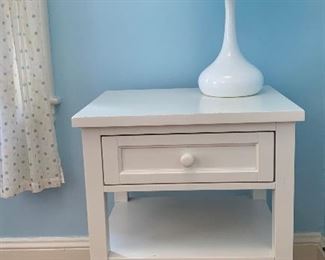 Pottery Barn Simple White Nightstand - This item is "wired". The nightstand itself gets plugged in and then in the back of the drawer, there are several outlets for phones, table lamps, etc.: $125