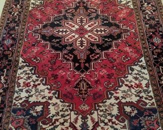 Vintage Persian Heriz hand-woven rug, measures 6' 4" x 9' 1".