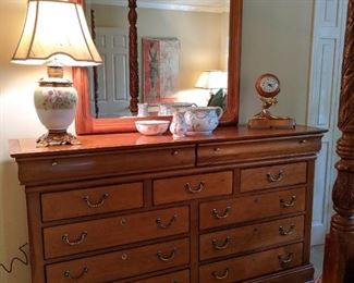 Blended elegance, this 11-drawer wonder, with beveled glass mirror, will store all of your PPE and boudoir essentials that none of your neighbors will ever discover.                                                       Live right, because your estate sale company comes and roots through all of your drawers.                                                                                             Shame on some of you!  ;-)