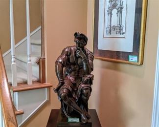 24" tall bronze, seated Roman gladiator, signed by the French foundry, F. (Ferdinand) Barbienne.                          The sculpture depicts Lorenzo de Medici dressed in his kilt. The original was part of a tomb that this famous Italian artist made between 1520 and 1534, for Lorenzo de Medici, the Duke of Urbino.                                                                                It is a reproduction of Michelangelo's (1475 - 1564) sculpture of Lorenzo de Medici, a  ruler of the Florentine Republic.