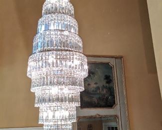 Beautiful Italian lead crystal 5' long chandelier welcomes you to this house, in the foyer.