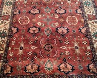 Persian design hand-woven rug, 100% wool face, measures 5' 8" x 8' 9".