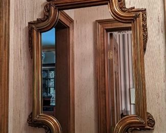 Vintage coppery-finish wooden wall mirror.