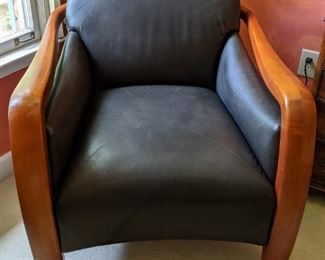 Amazing wood/leather "Picasso" chair, by Sam Moore, with matching ottoman. The chair/ottoman, which has been retired, cost $2,200.00 and the ottoman, a cool $900.00. 
