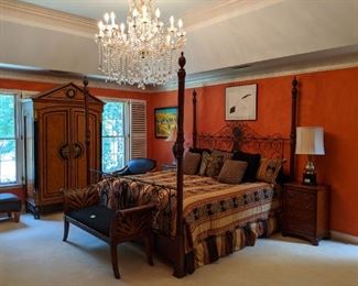 Master bedroom, with Drexel Heritage king size bed, 16-light Italian Maria Theresa lead crystal chandelier, pair of antique English 4-drawer nightstands, animal print settee, empire style armoire.