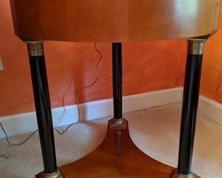 One of a pair of Italian, empire style round side tables.