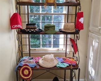 It's a travel thang - wherever they wandered, they brought home a typical hat from that country - those jingle-jangle shops need something to sell to the rich Americans!  ;-)
