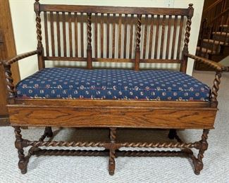 Vintage barley-twist oak bench, with carved notches in arms, for pool cues.
