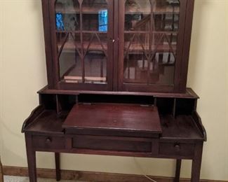 RARE plantation walnut secretary (ca. 1840-1860) glass front with wood, lift desk top, four tapered legs.             The next couple of pics show the rear of the piece and how old it is, indeed.