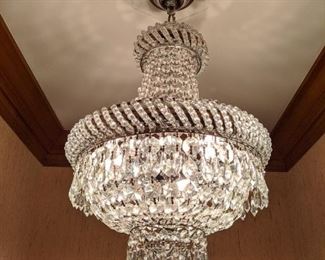 Cute, 3-light crystal "crown" chandelier in hallway.