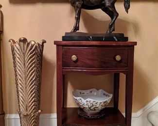Vintage one-drawer Canadian mahogany side table, with bronze horse, on black marble stand.
