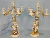 321 - Pair of Dresden Porcelain Candelabras with cupids and flowers, 22 in. T