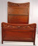 131 - Mahogany Heavily Carved High Back Bed, labeled R.J. Horner, with faces carved in crown, 82 in. T, 56 in. W, 77 in. L, ca. 1890