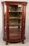170 - Mahogany Curved Glass China Cabinet, att. To R.J. Horner, claw feet and carved column front, 66 in. T, 43 in. W, 17 in. D, original finish, ca. 1890