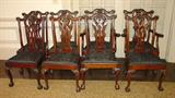 403 - Set of 8 mahogany Ribbon Back Dining Chairs with slip seats and ball and claw feet, 2 arm chairs, ca. 1890.