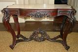 303 - Rosewood Rococo Insert Marble Center Parlor Table in original finish, 30 in. T, 46 in. L, 23 in. W, ca. 1850.