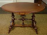 182 - Oval Walnut Victorian Center Table with gold sizing, att. To Herter Brothers, 43 in. L, 25 in. D, 29 in. T.