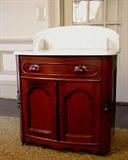 181 - Walnut Victorian Marble Top Wash Stand with rounded corners, wood carved pulls and back splash on marble, 38 in. T, 31 in. W, ca. 1860.