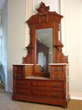 120 - 4 pc. Mitchell & Rammelsberg Victorian Bedroom Suit, High back bed, Drop Center Dresser, 3 drawer washstand, massive wardrobe, original finish, ca. 1870. Dresser, 8ft. 7in. T, 53in. W, 21in. D.