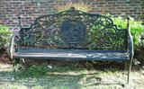 704 - Victorian Cast Iron Garden Bench with birds and lady holding bird cast in back, 43 in. T, 74 in. L, 18 in. D.